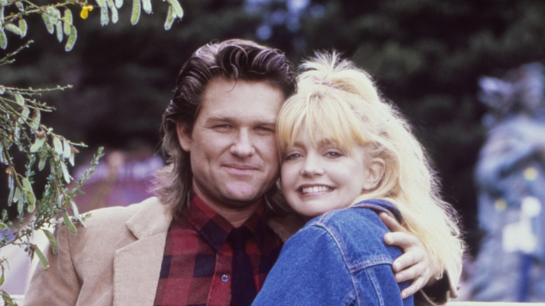 Young Kurt Russell and Goldie Hawn hugging