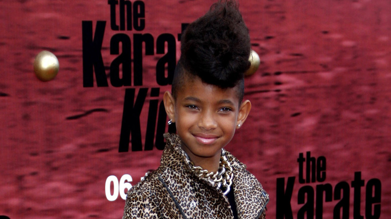 Willow Smith at an event in 2010 wearing an animal-print outfit with voluminous hair.