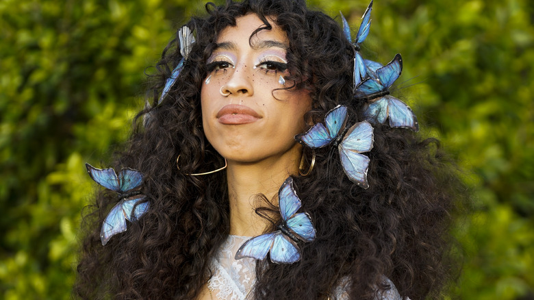 Woman with butterflies in her hair