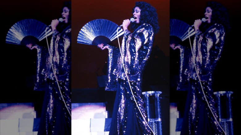 Donna Summer performs in a sequined robe and with a fan in Los Angeles in the 1970s
