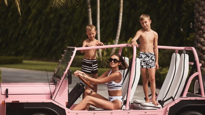 Paulina Gretzky posed in a pink Jeep with her sons, Tatum and River Johnson.