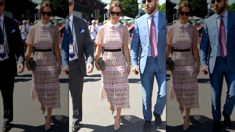 Pippa Middleton wearing a pink knit dress and sunglasses holding a gray clutch walking at Wimbledon in 2017.
