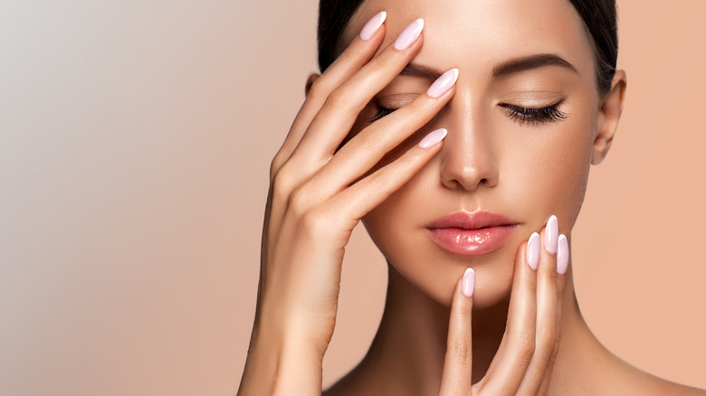 Woman with long healthy nails