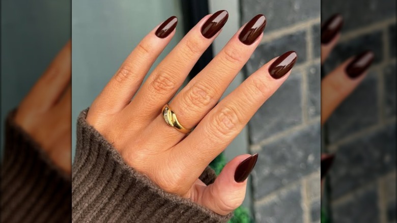 A round manicure with chocolate brown nail polish