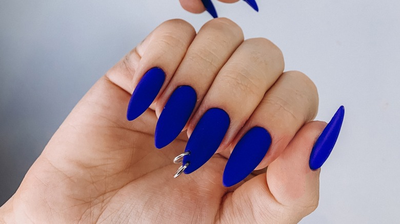 blue nails with piercing