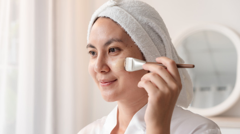 Woman applying foundation