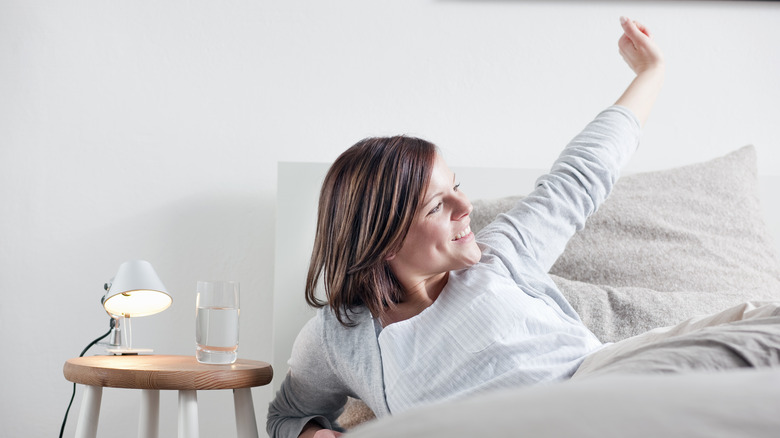 woman waking up in bed