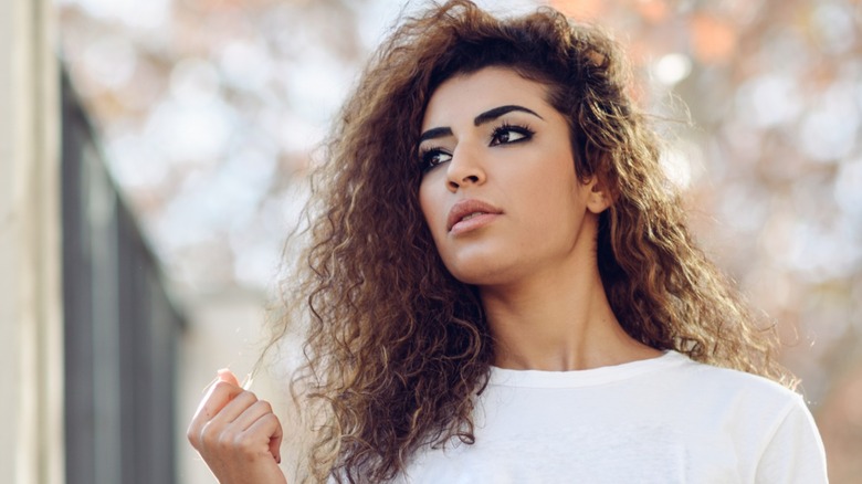 Woman with long curly hair