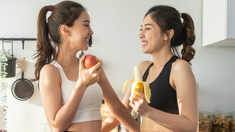 women eating fruit