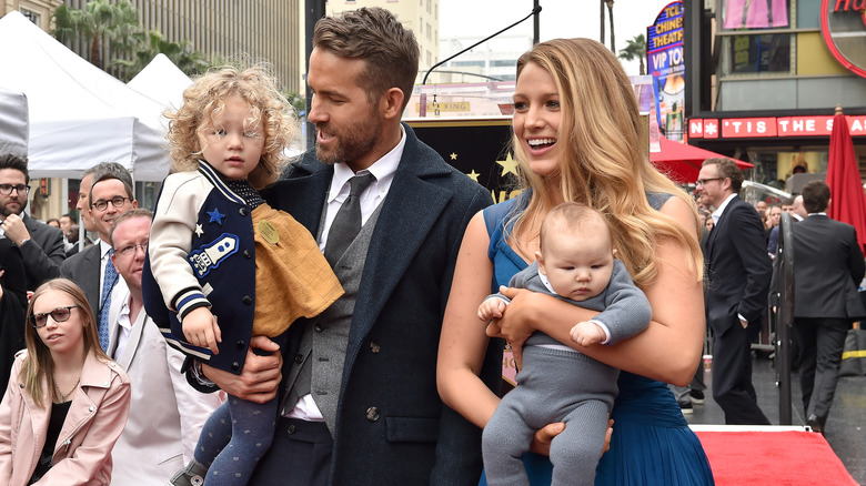 Ryan Reynolds and Blake Lively with two of their daughters on the red carpet in 2016.