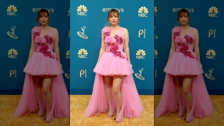 Kaley Cuoco poses in a pink tulle dress with a dramatic high-low hemline