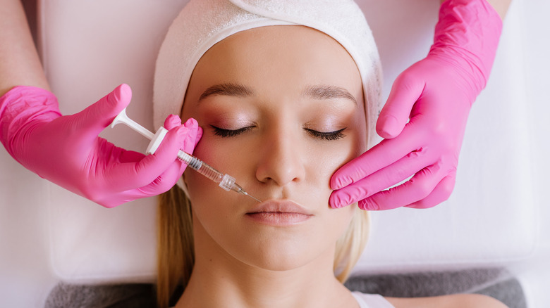 woman getting lip injections