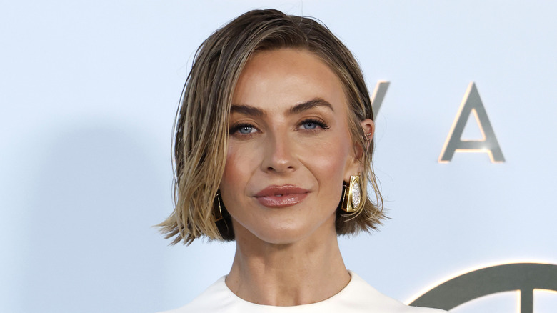 Julianne Hough at a red carpet event with wet-looking hair
