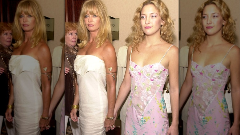 Goldie Hawn and Kate Hudson hold hands at the Crystal Awards luncheon