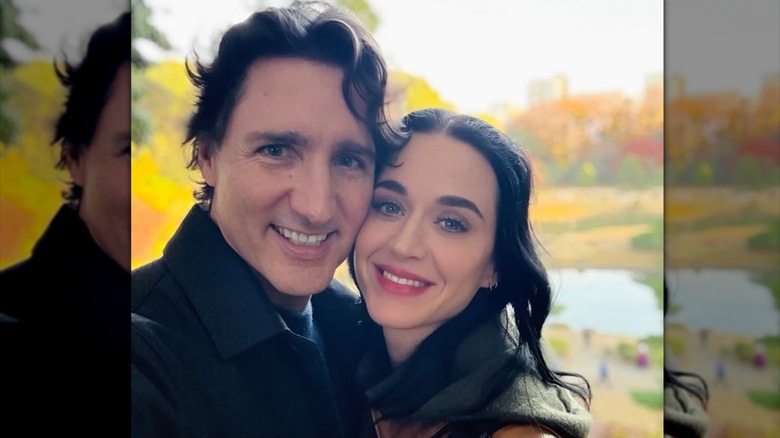 Katy Perry and Justin Trudeau taking a selfie outside