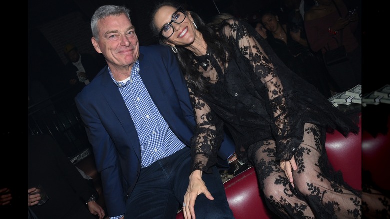 Jami Gertz and Tony Ressler posing together at a party