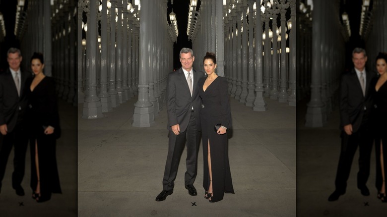 Jami Gertz and Tony Ressler posing together at a gala