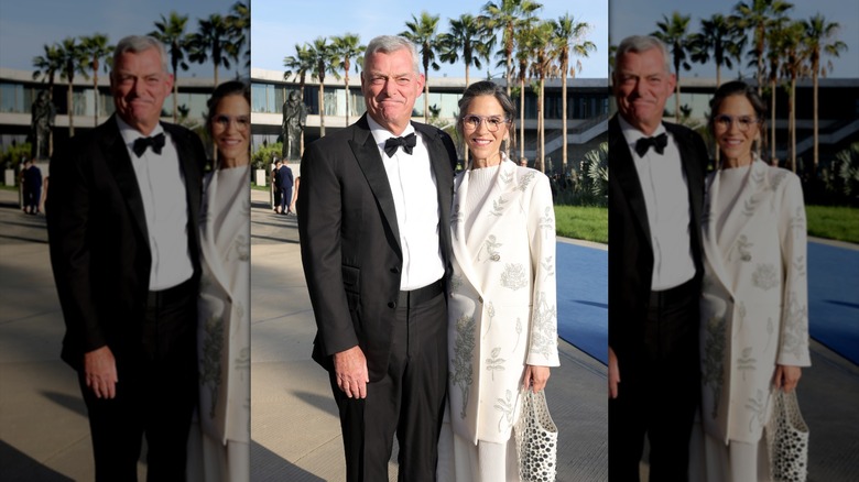 Jami Gertz and Tony Ressler posing at a gala