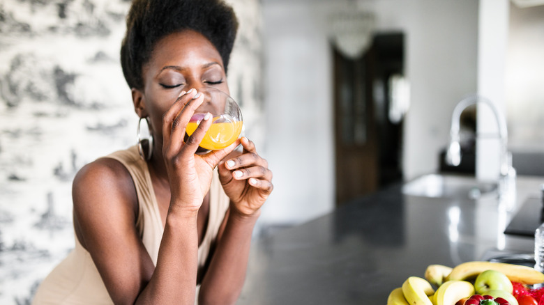 Woman drinking orange juice