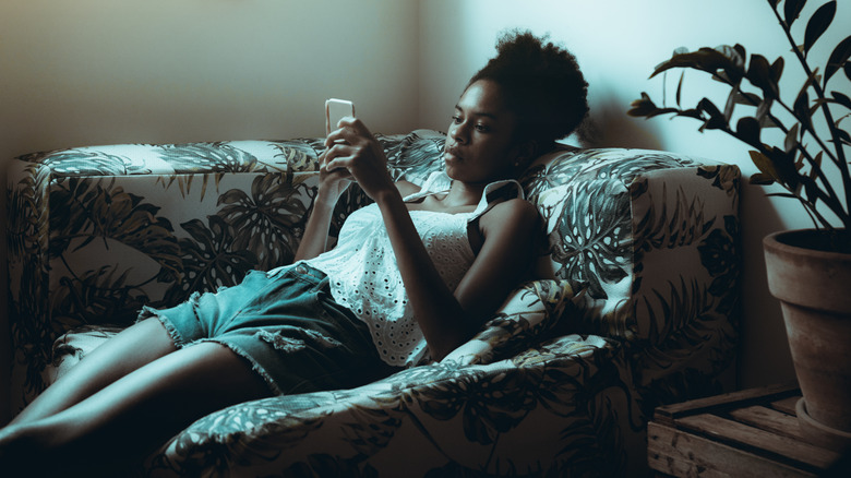 women relaxed on sofa