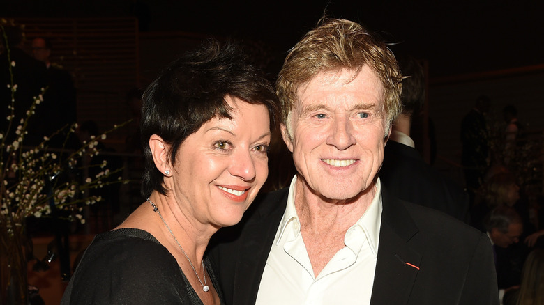 Robert Redford and his wife, ﻿﻿Sibylle Szaggars, smiling and posing for a photo Redford at the ﻿42nd Chaplin Award Gala