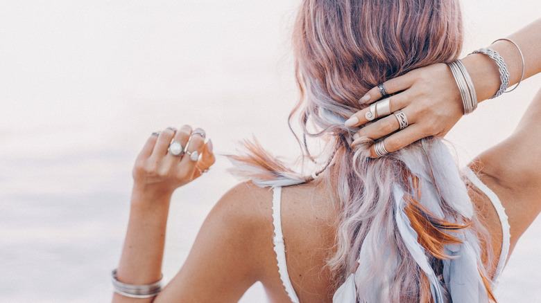 Beachgoer wearing lots of jewelry