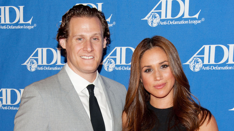 Meghan Markle and Trevor Engelson smiling