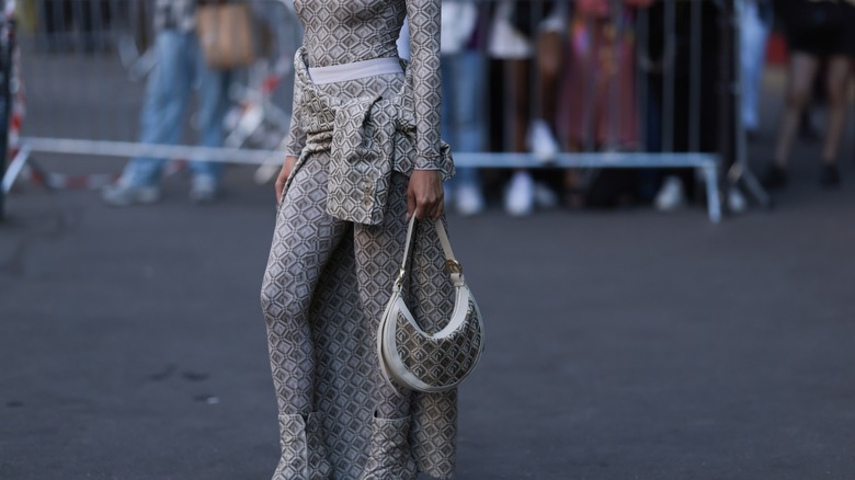 woman with tied sweater