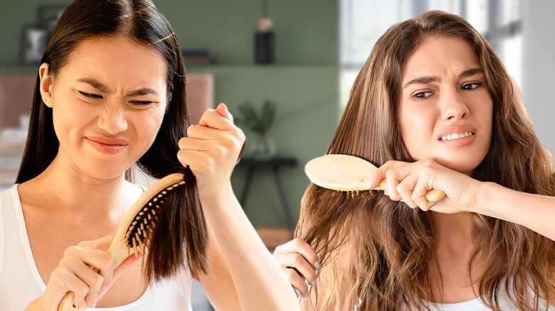 Two women grimacing as they brush their hair