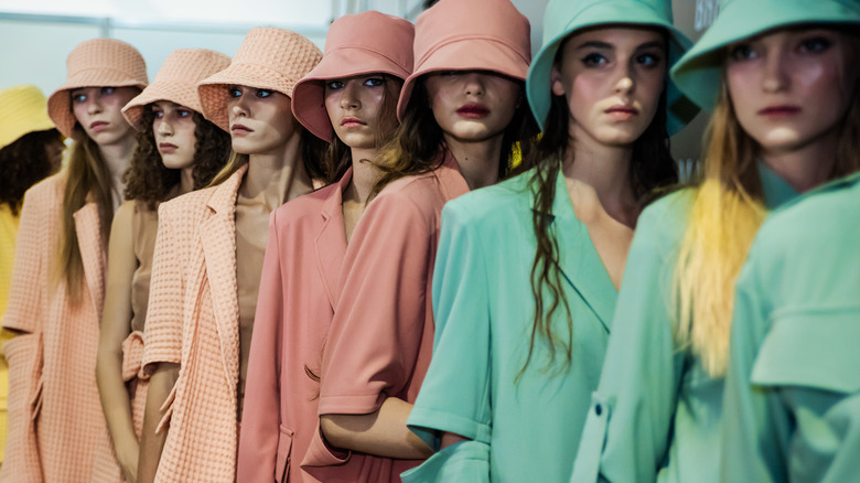 Models lined up wearing pastel
