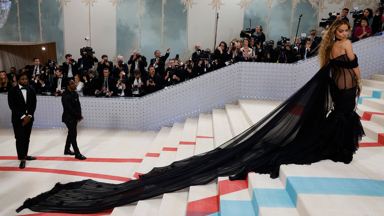 Woman walking the Met stairs