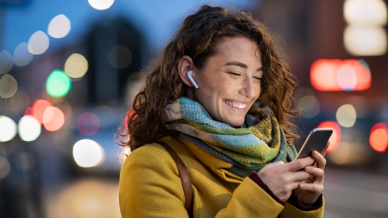 woman using phone outside 