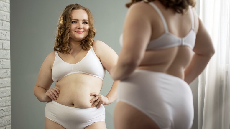 Smiling woman in mirror