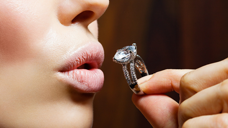 woman holding engagement ring