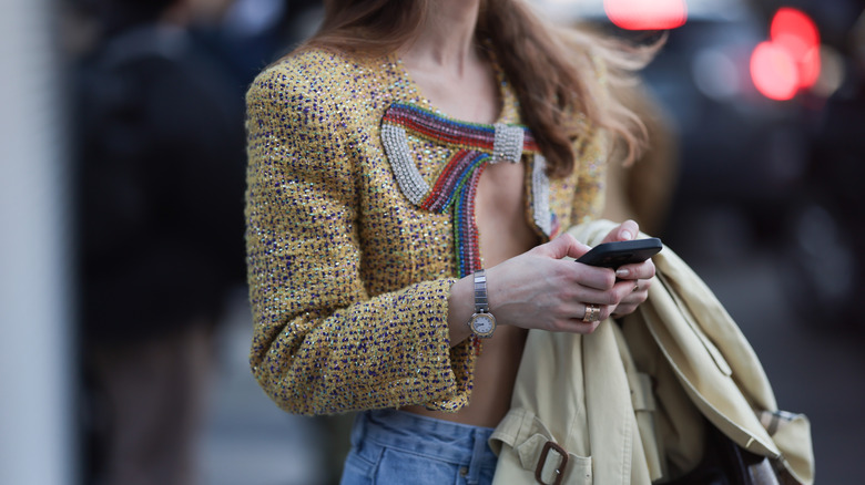 woman wearing analog watch