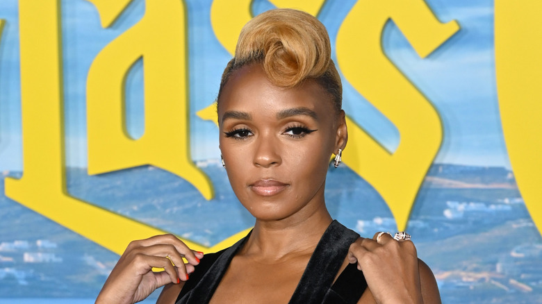 Janelle Monáe posing with a pompadour hairstyle