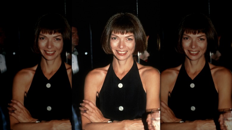 Anna Wintour smiles with dark brown hair