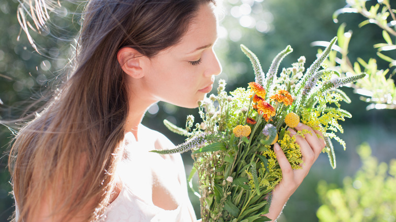 Woman cradles wildflowers