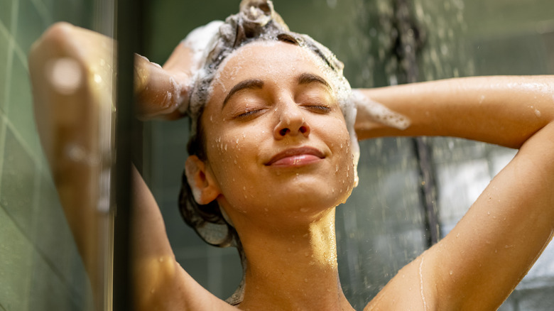 person shampooing their hair