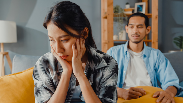 Sad woman fighting with boyfriend