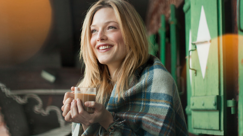 Woman holding a mug of coffee
