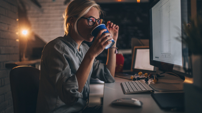 Woman working hard at night