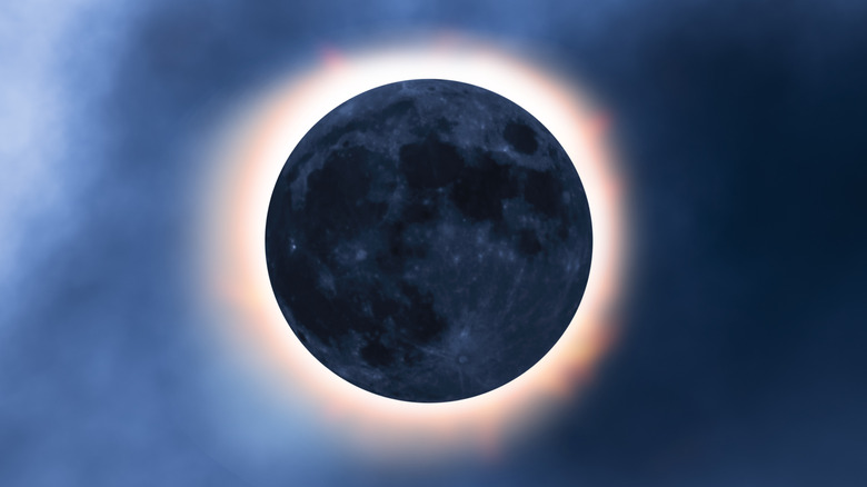 Dark moon eclipsing the sun