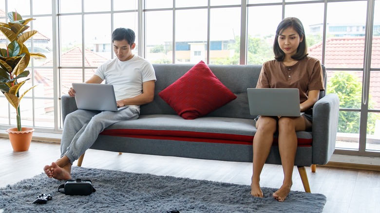 Couple working alone together