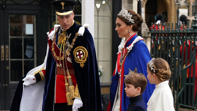 Catherine, Princess of Wales and Prince William, Prince of Wales with Princess Charlotte and Prince Louis arrive at the Coronation of King Charles III and Queen Camilla on May 6, 2023 in London, England (2023)