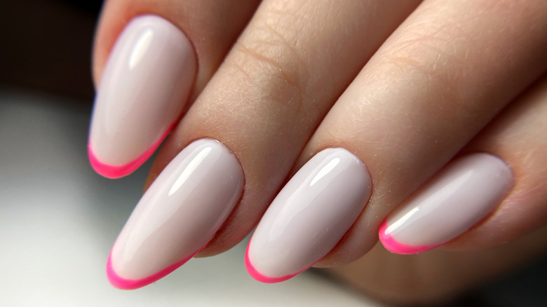 Mini French nail design with neon pink tips