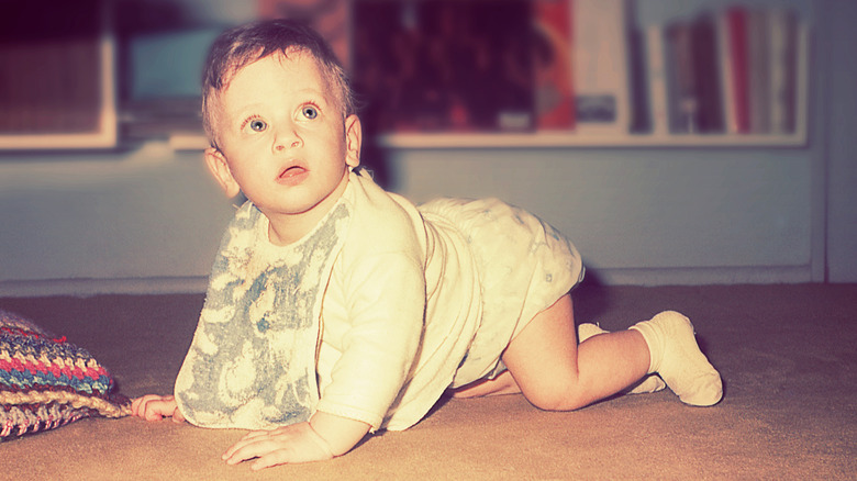 Baby boy crawling on the floor