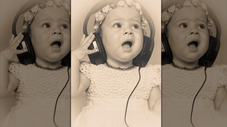 Vintage picture of a baby with headphones