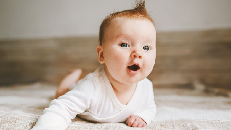 A cute baby with red hair