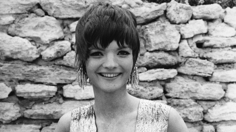 Linda Morand on set of "Pussycat Pussycat" wearing huge earrings